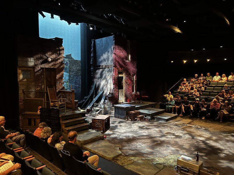 The set for August Wilson's King Hedley II, a brick Pittsburgh backyard