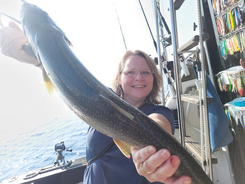 Jody holding up the fish she landed