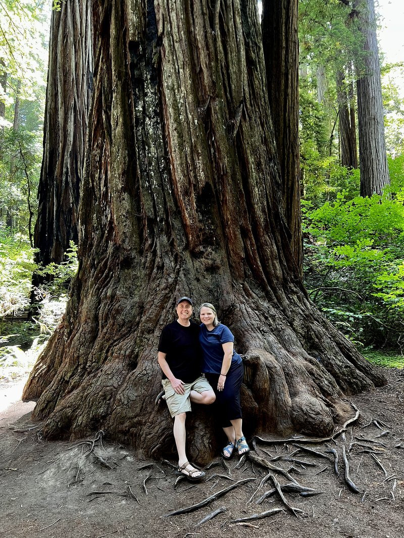 Justin and Jody at the base of an enormous redwood