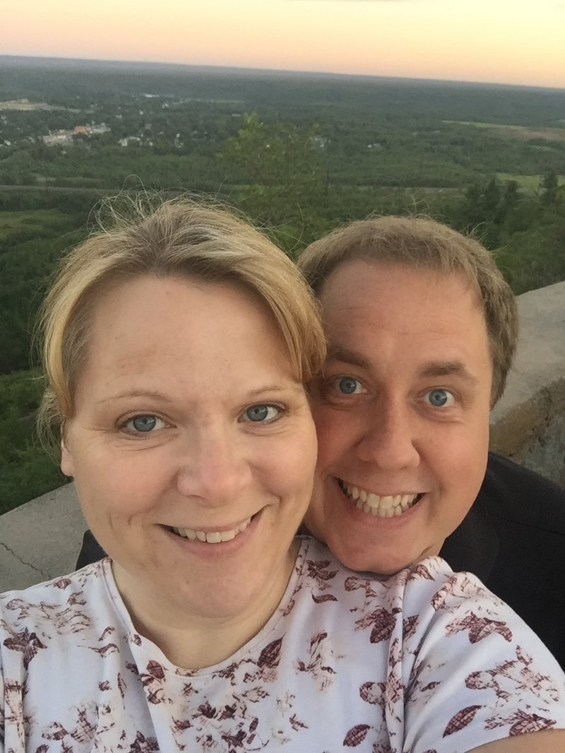 Jody and Justin taking a selfie at an overlook along Skyline Drive at sunset