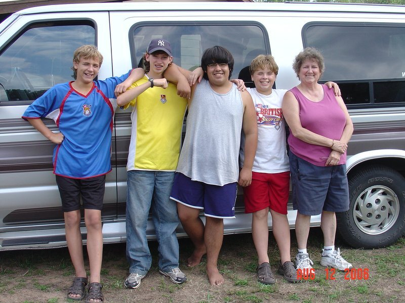 The kids and Grandma lined up in front of the van before the treehouse party
