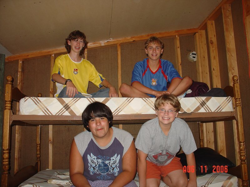 Four boys on the bunk beds inside the treehouse