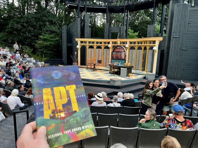 The golden arched storefront set for The Matchmaker on the Hill Theatre stage