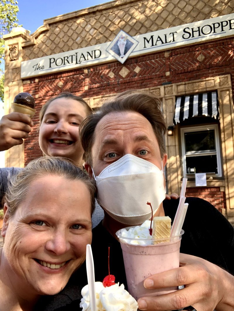 Jody, Kaylee, and Justin with cones and malts outside the Portland Malt Shoppe, Justin in a mask