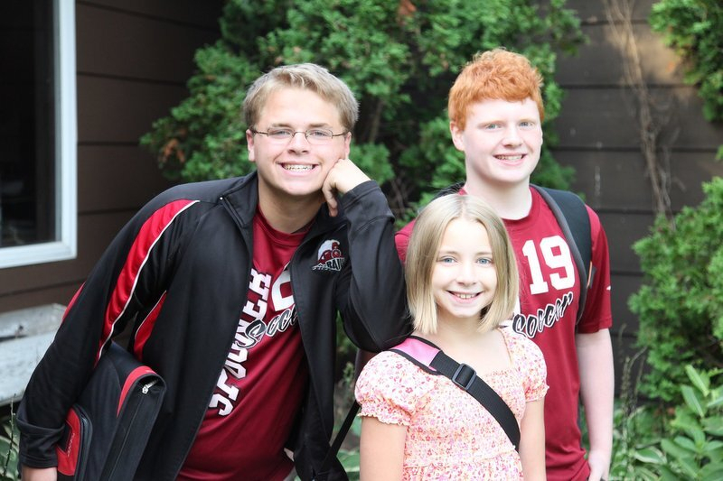 Spencer, Corey, and Kaylee on the front porch for first-day-of-school pictures