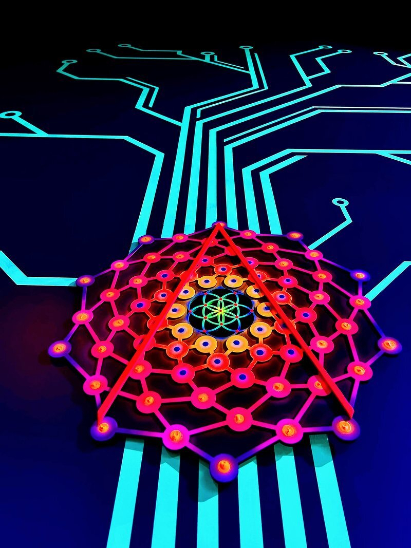 A neon geodesic web glowing red and orange above a circuit board of cyan lines