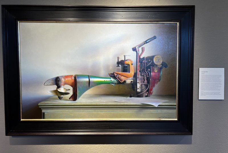 A Jeffrey Larson painting of an antique metal hand tool resting on a ledge against a soft gray background