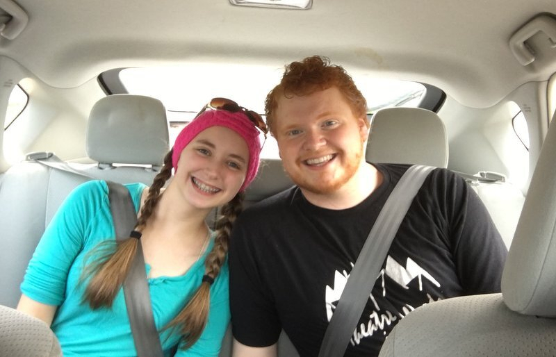 A smiling car selfie of Kaylee and Spencer