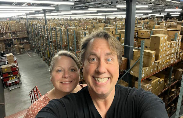 Jody and Justin in a huge warehouse