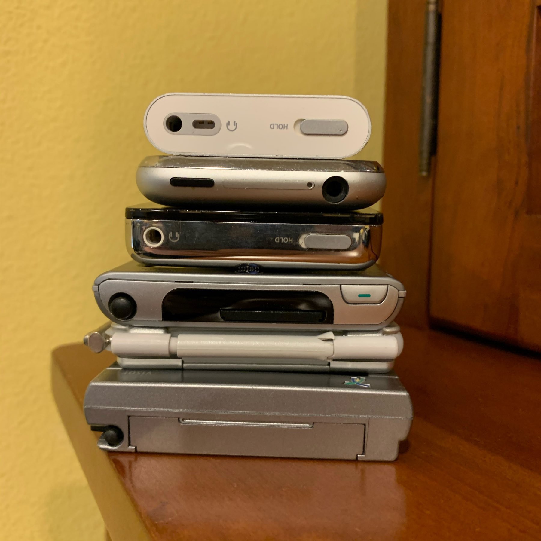 Top to bottom: iPod mini, Gen 1 iPhone, iPod, Palm Tungsten T3, Handspring Visor Edge, Handspring Visor Platinum