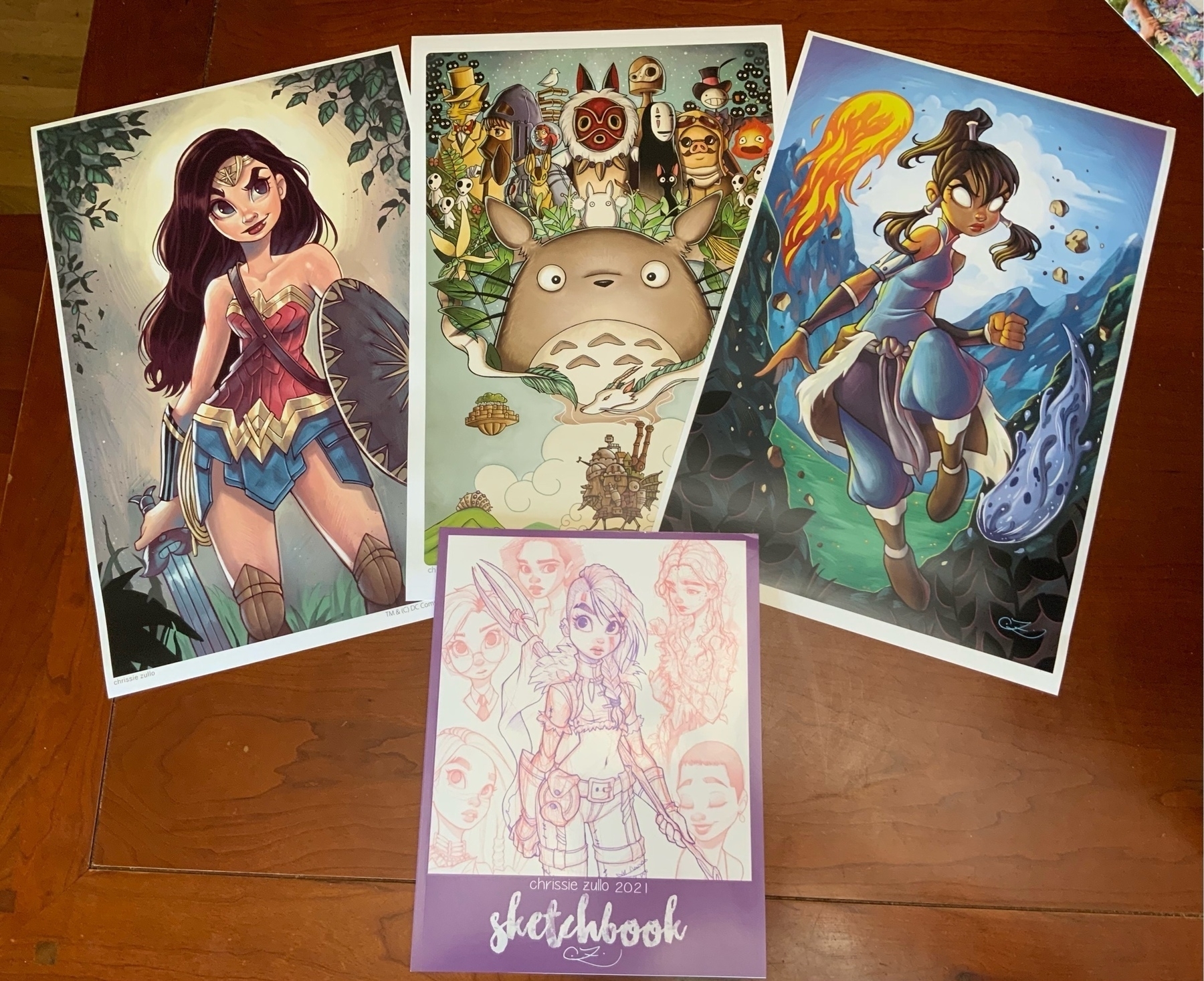 11"x17" prints: Wonder Woman, Tribute to Miyazaki, and Korra, plus 2021 Sketchbook.