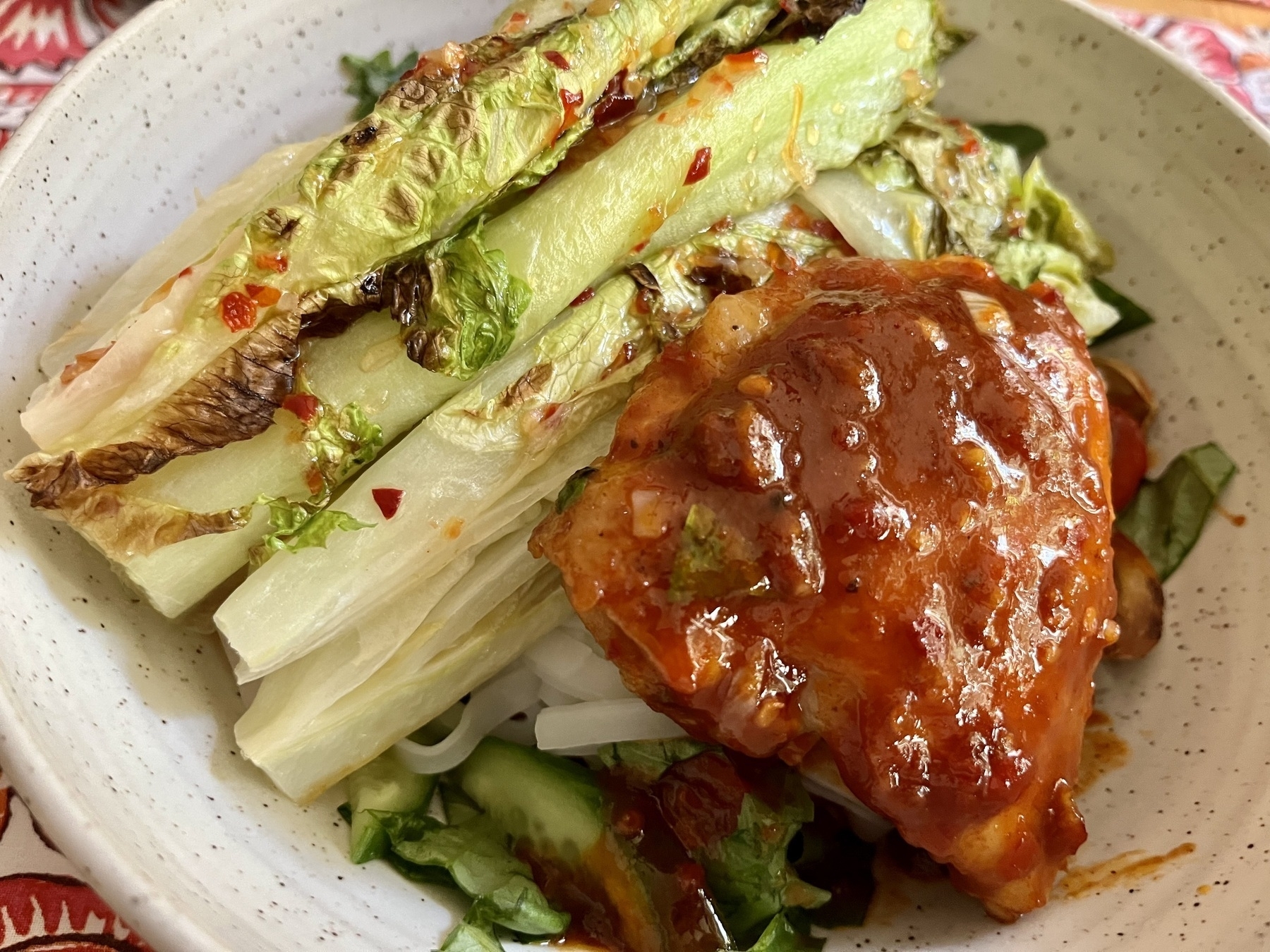 Grilled Romaine with Korean spicy chicken and rice noodles