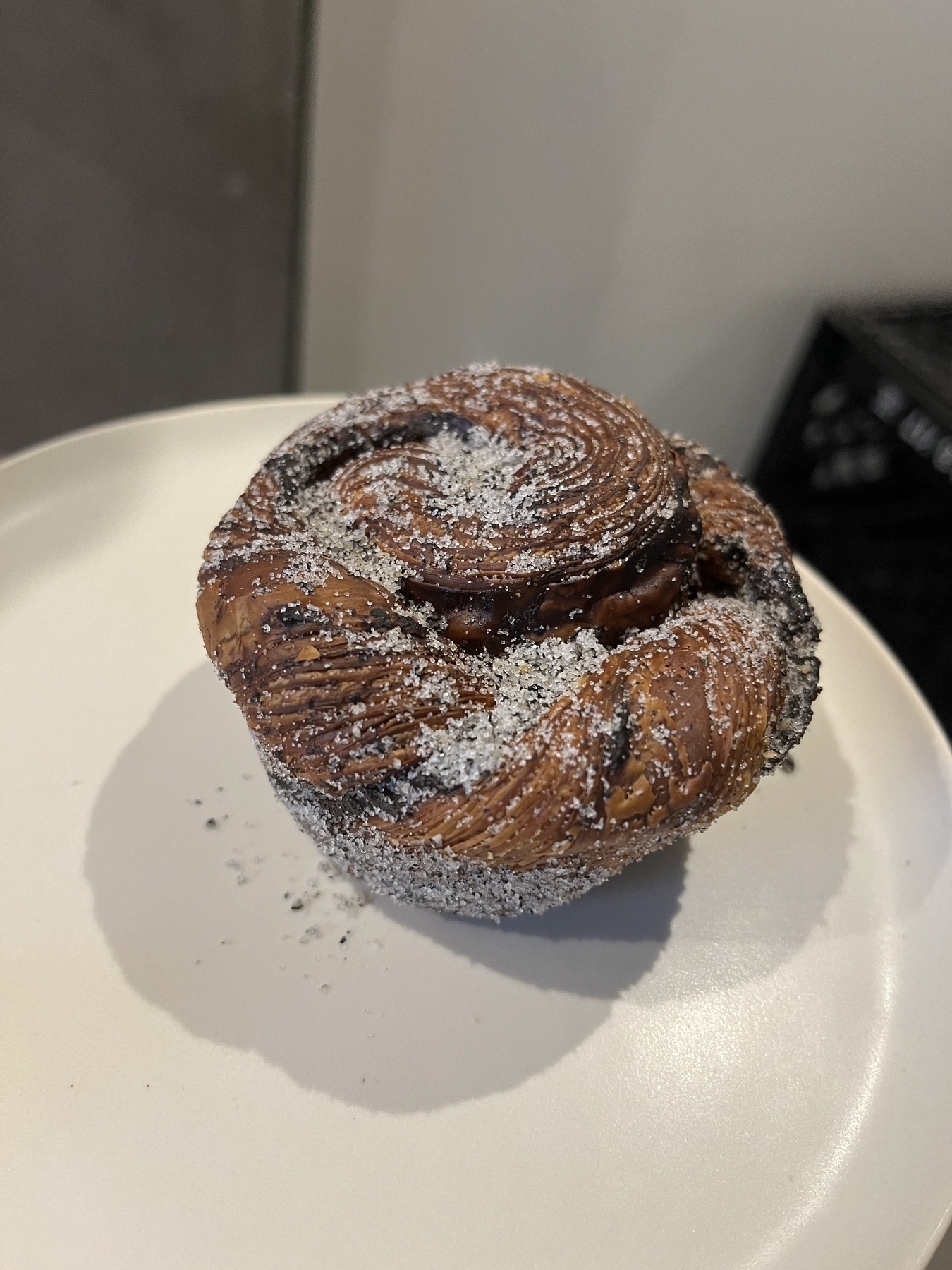 A twist? A knot? I don’t like the word cruffin. Dusted with sugar and filled with sweet black sesame. 