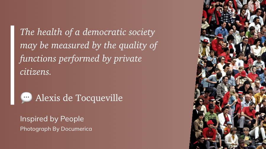 A quote by Alexis de Tocqueville discussing the health of a democratic society is set against a background featuring a diverse crowd of people.