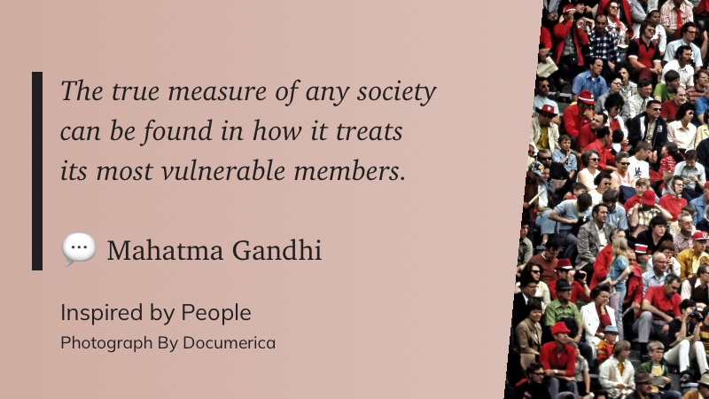 A quote by Mahatma Gandhi about societal values is displayed alongside a photograph of a diverse group of people.