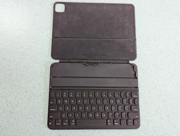 An old Smart Keyboard Folio, with the top lining starting to peel off