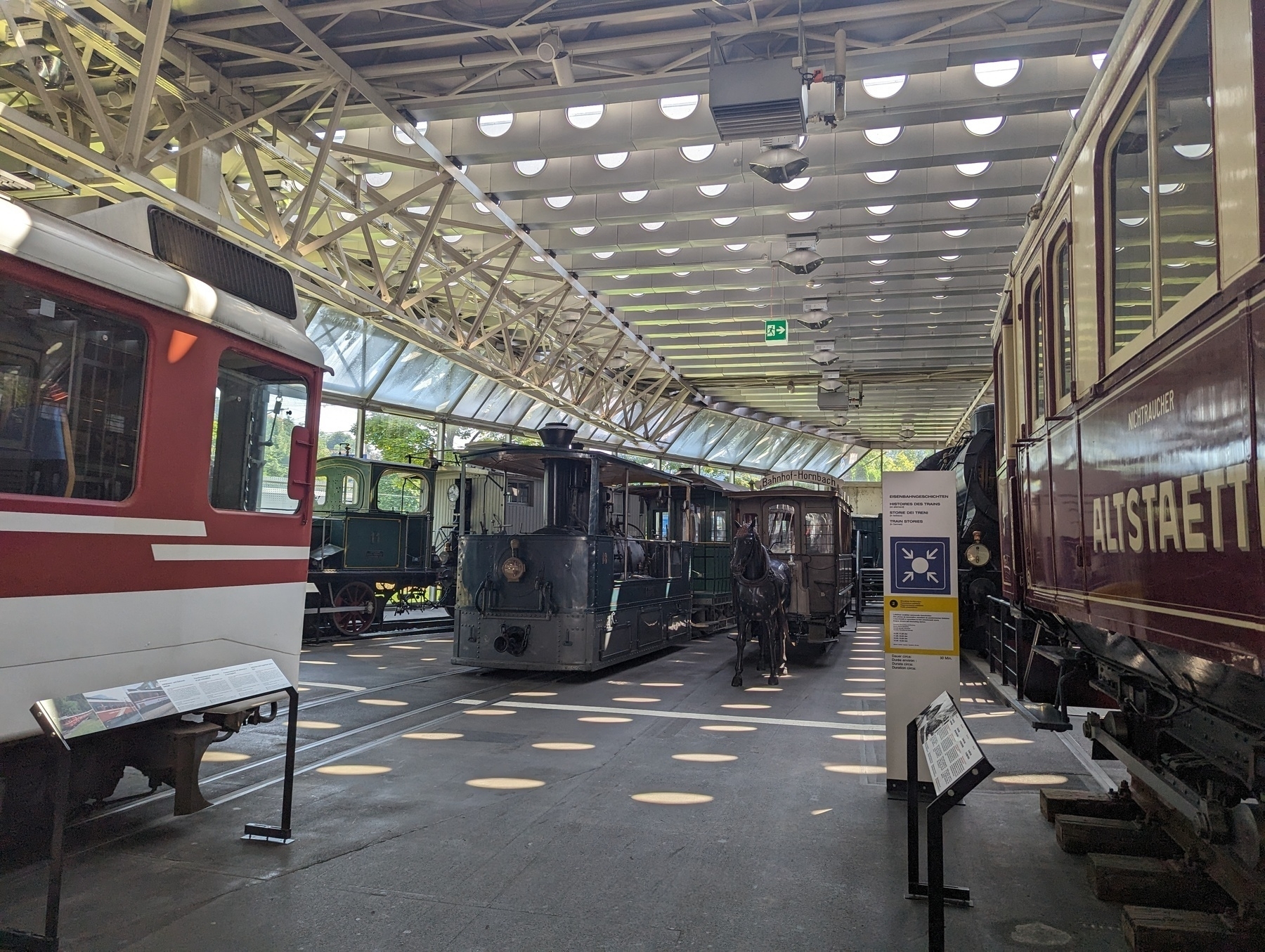 A collection of stem locomotives in an exhibition centre.