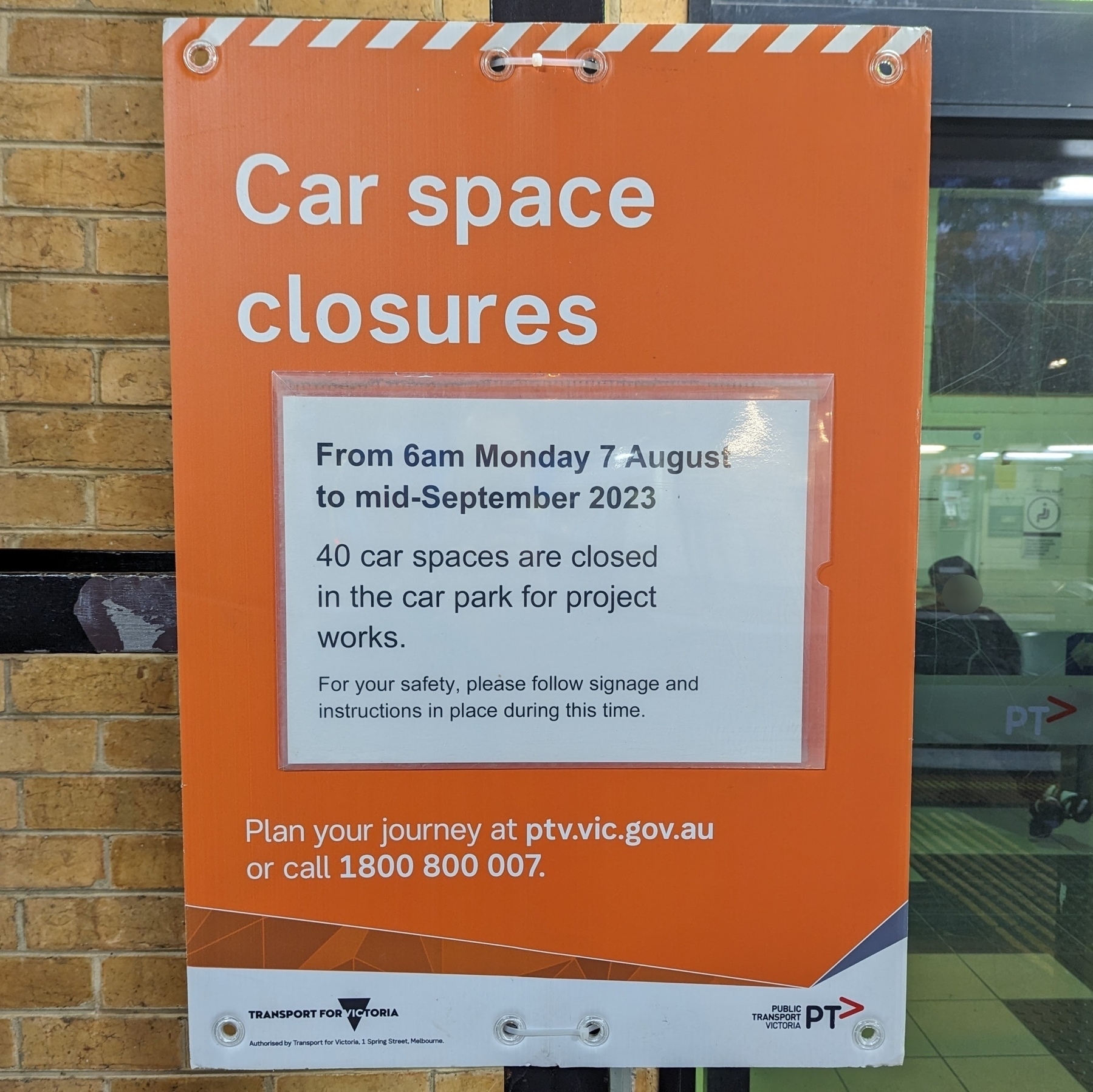A large orange sign that reads 'Car space closures', along with details of when the car park will be closed and how many spaces would no longer be available