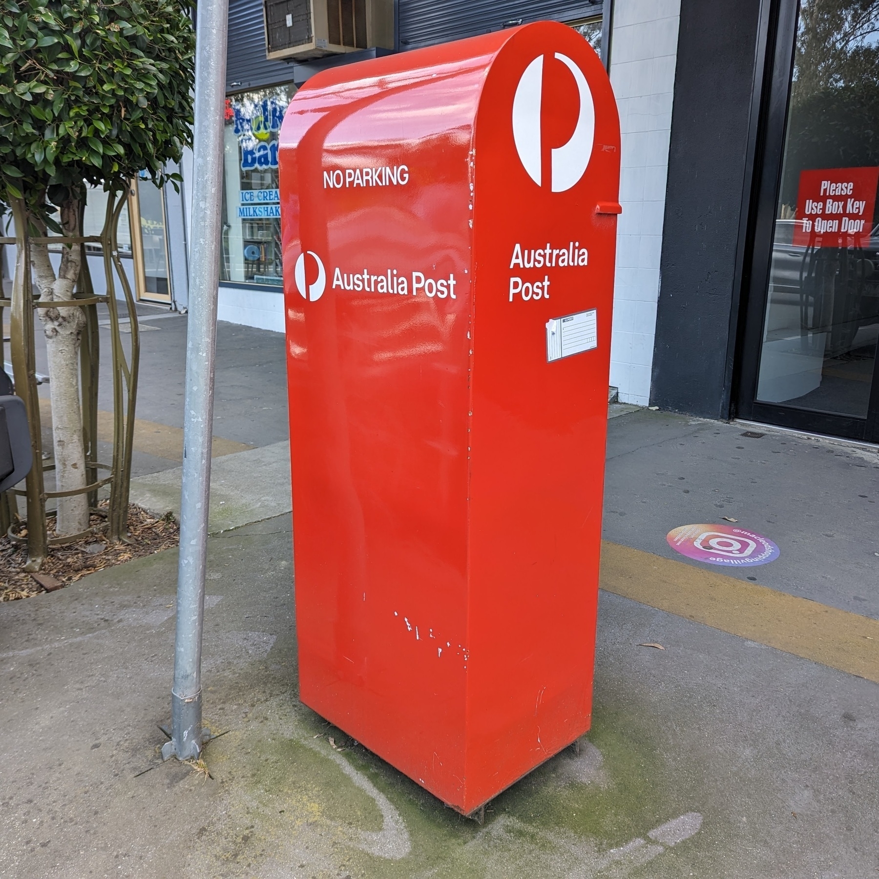 A red Australian Post mailbox