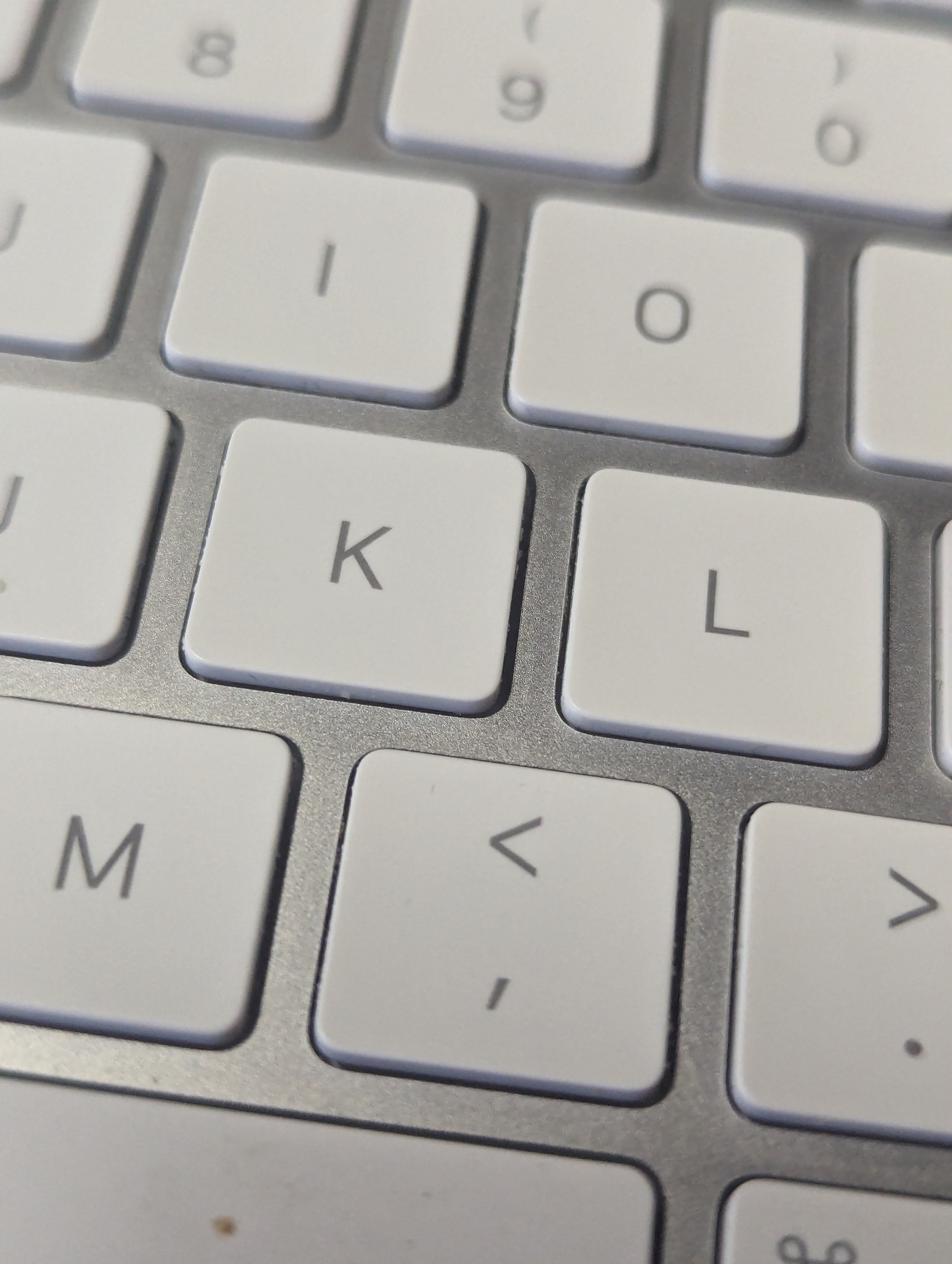 Photo of the Apple magic keyboard with focus on K, L, and M.