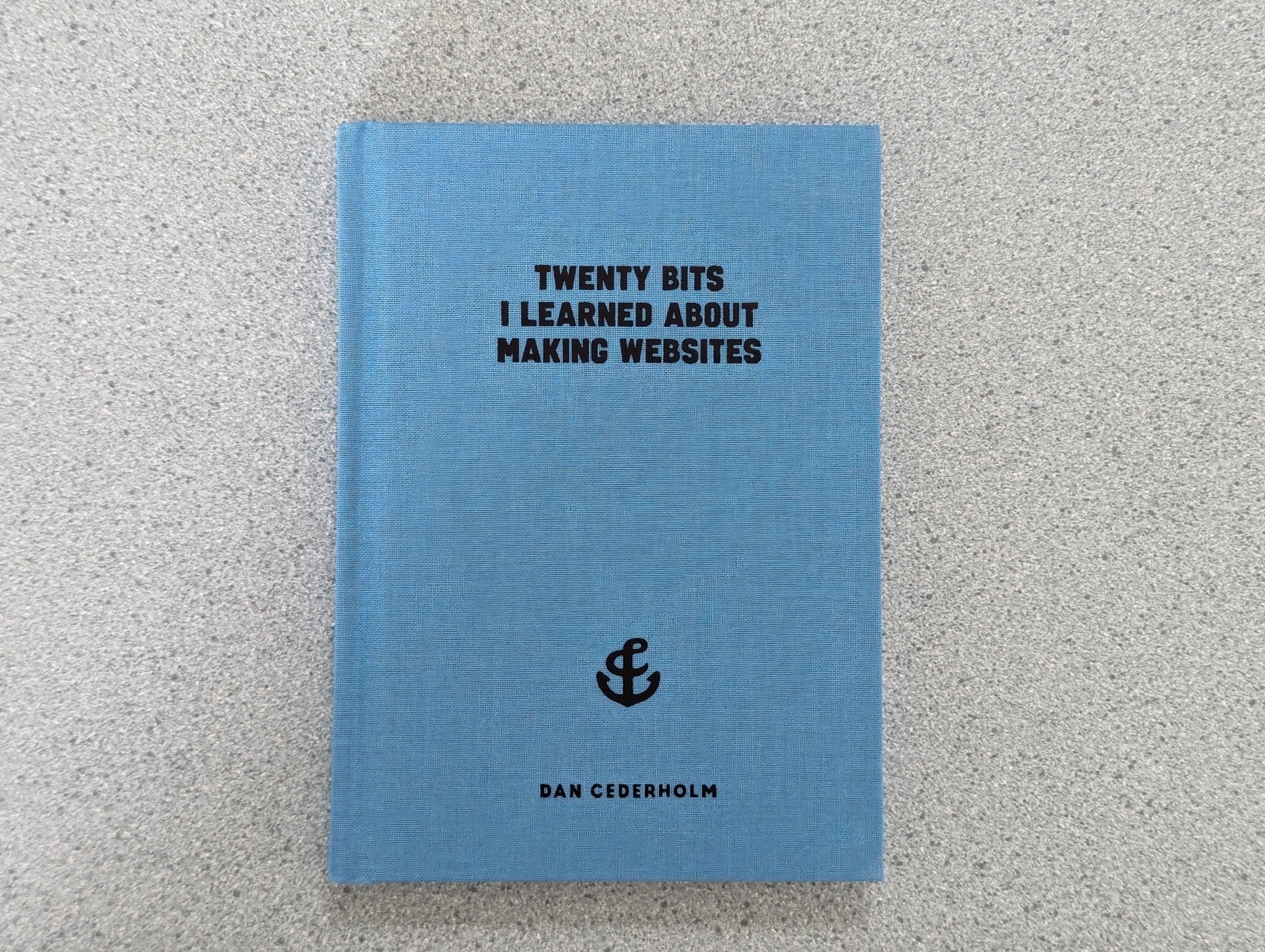 A blue book with the title Twenty Bits I Learned about Making Websites