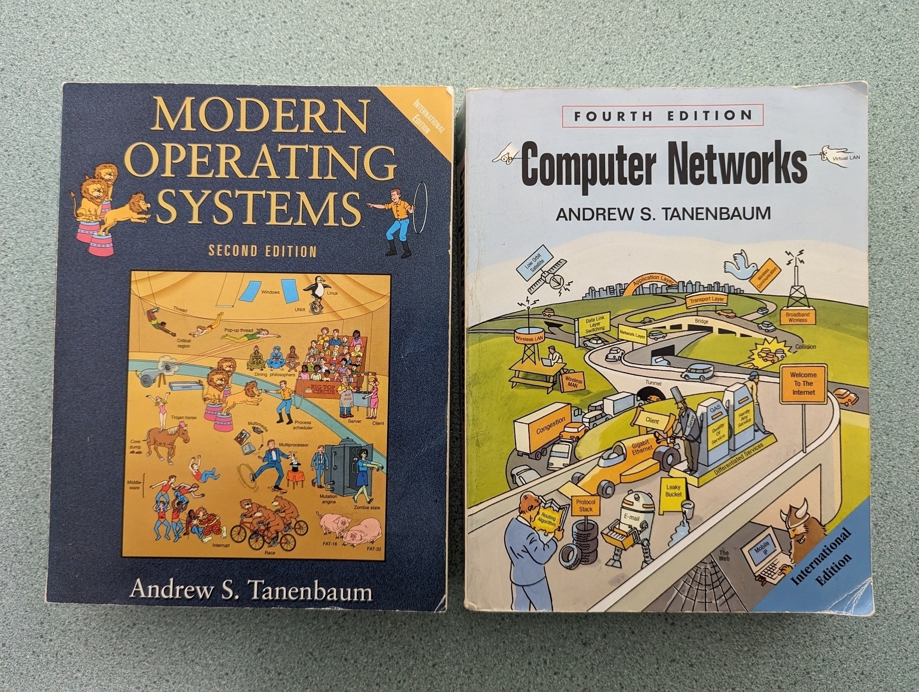Auto-generated description: Two textbooks titled Modern Operating Systems and Computer Networks by Andrew S. Tanenbaum are placed side by side on a surface.