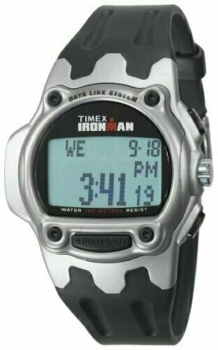 Auto generated description:  A Timex Ironman digital watch with a black strap displays the time as 3:41 and is water-resistant up to 100 metres