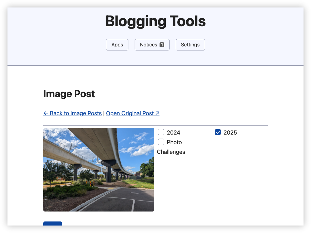 Auto-generated description: A screen displays a blogging tool interface with an image of an elevated roadway and options for categorizing an image post.