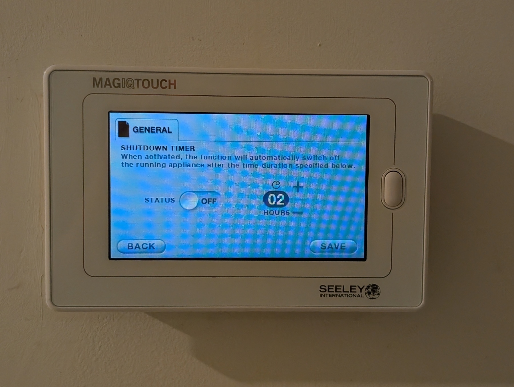 Auto-generated description: A MagIQtouch thermostat displays a shutdown timer set for 2 hours on its touchscreen.