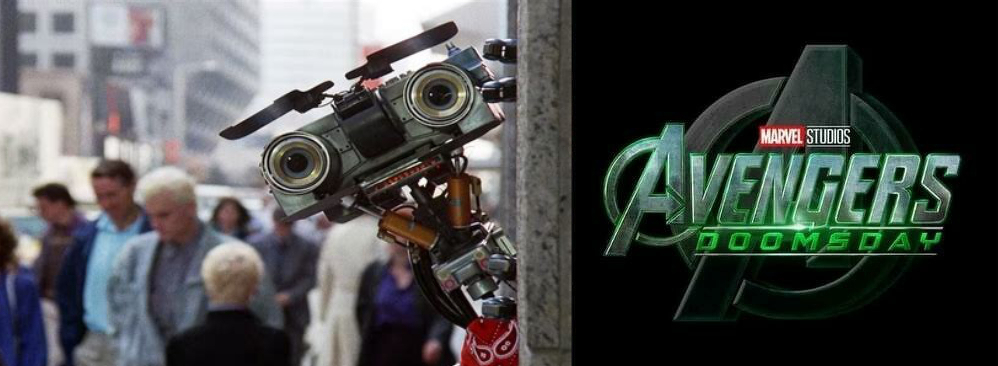 Johnny Five from Short Circuit, a robot, peeks around a corner in an urban setting next to a fictional Avengers: Doomsday logo.