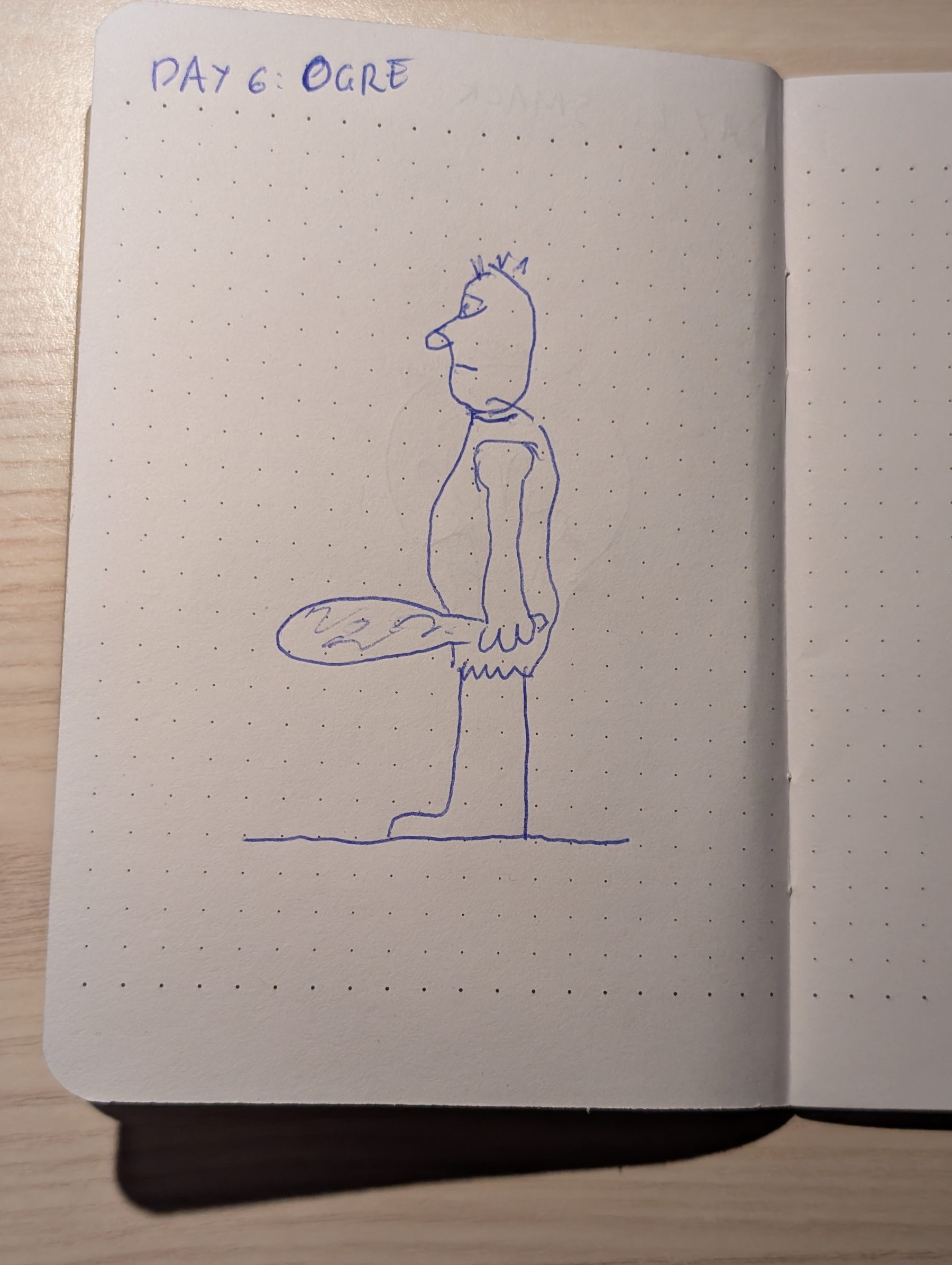 Auto-generated description: A simple blue ink drawing of an ogre holding a club is sketched on a dotted notebook page labeled Day 6: Ogre.