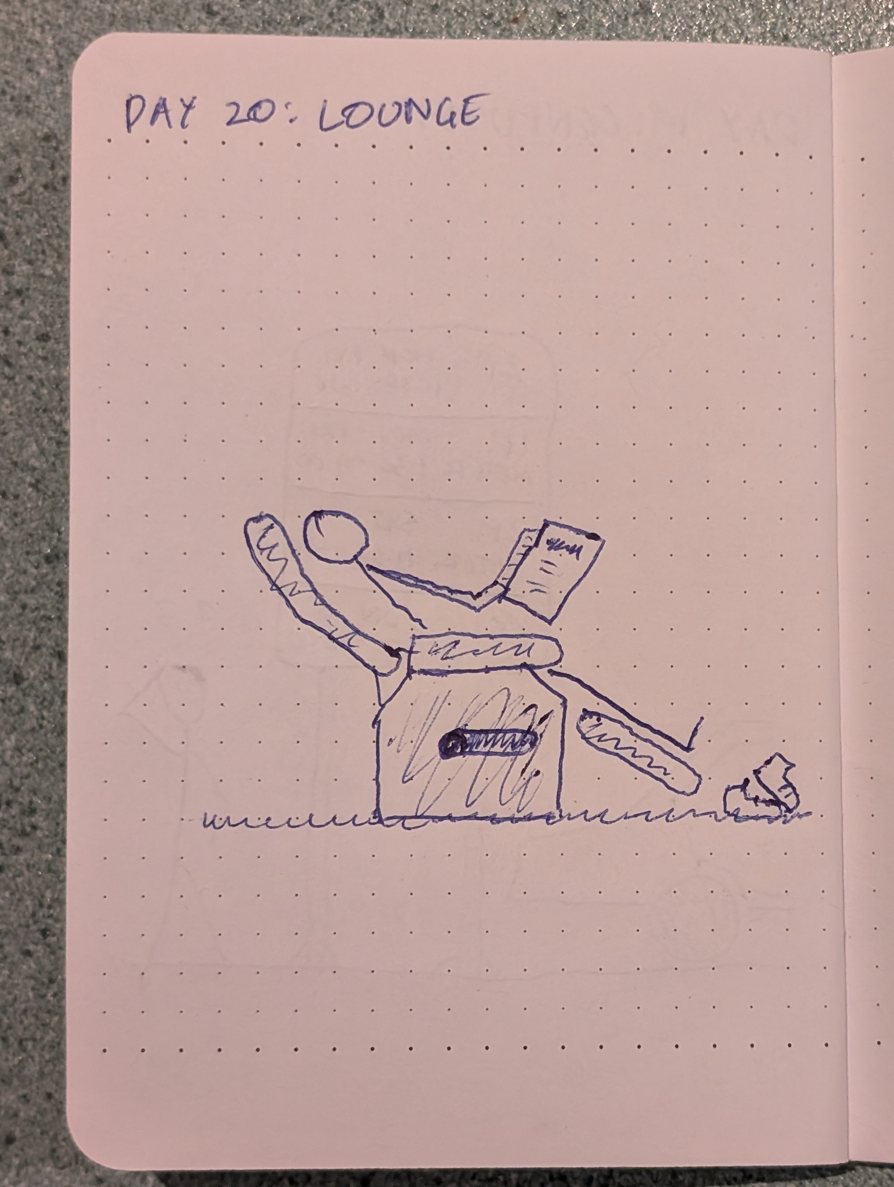 A person is reclining in a lounge chair while reading a book.