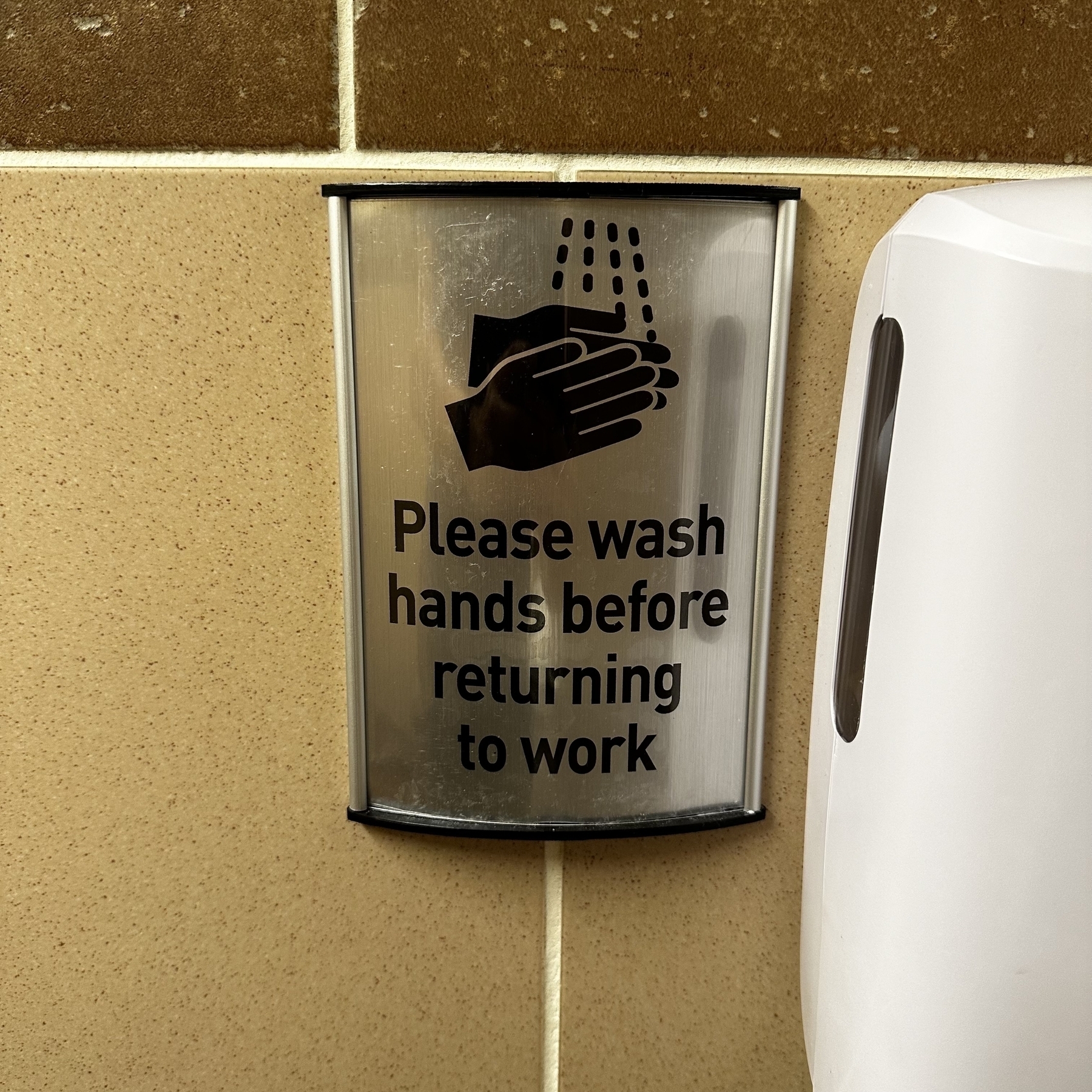 Please wash hands before returning to work sign.
