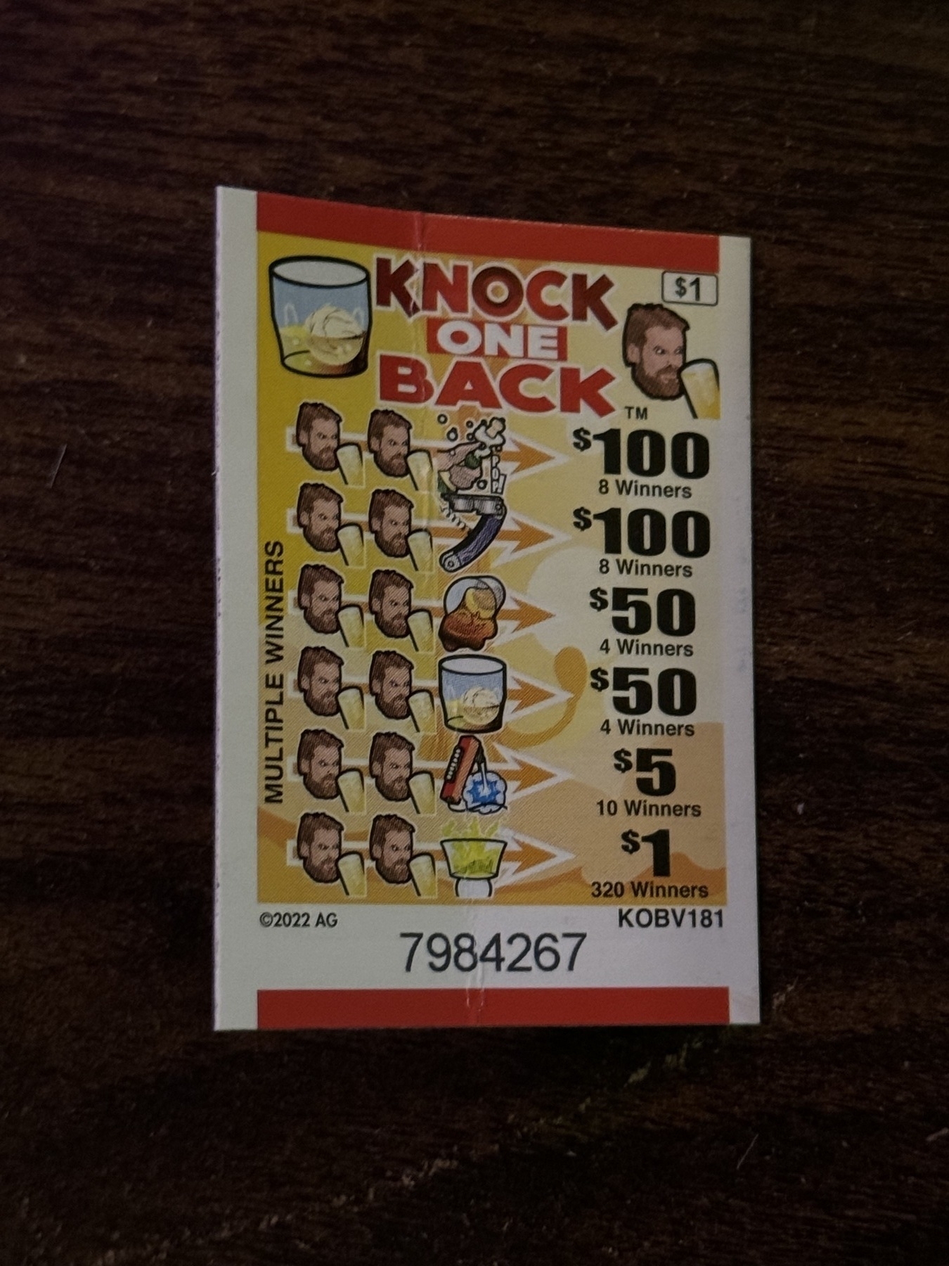 pull-tab ticket backside with winning list against icons including a white guy (angry, maybe?), soda gun, wine key, spilled cocktails, etc.