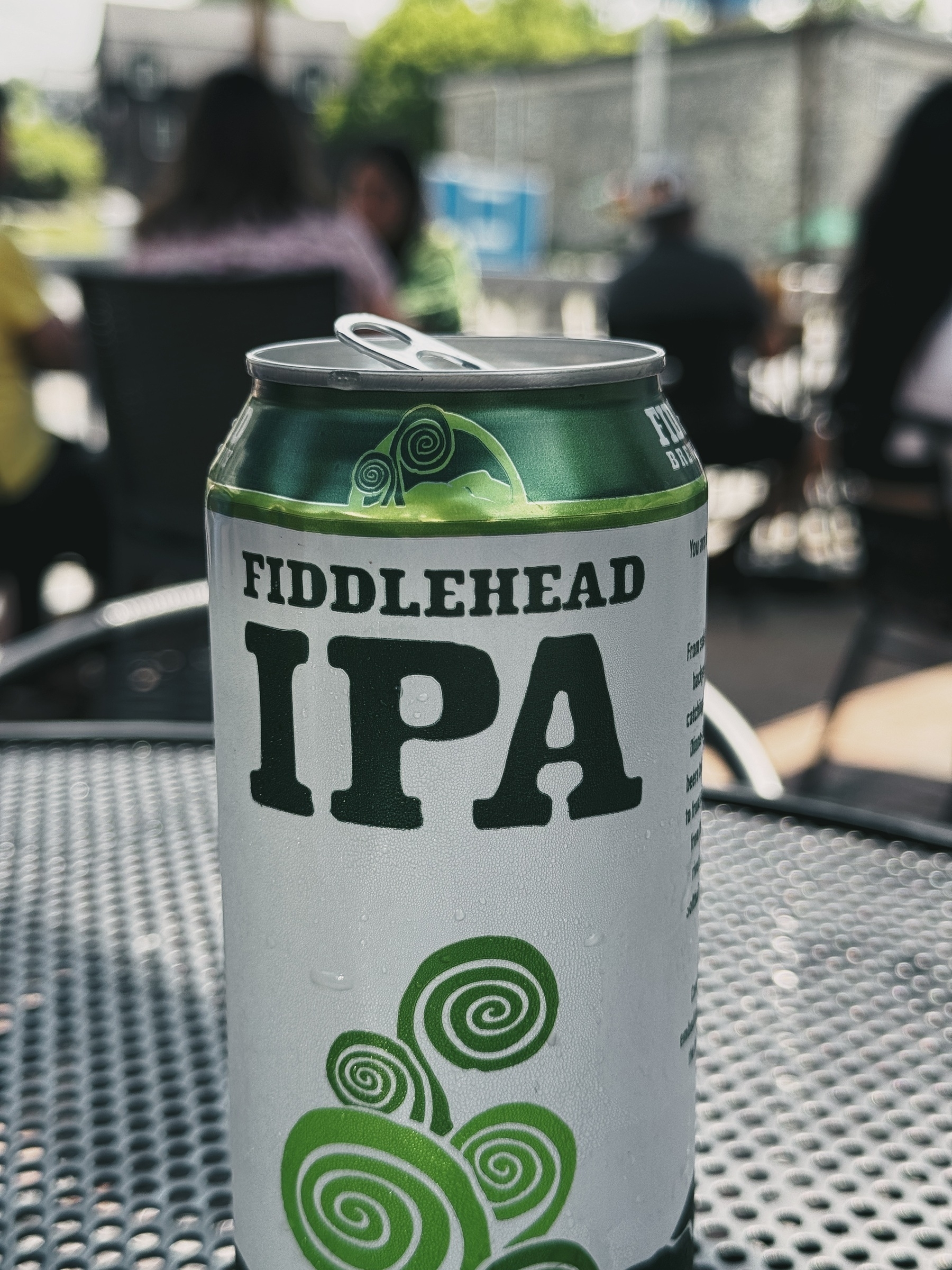 green can of Fiddlehead IPA on a metal tabletop outside