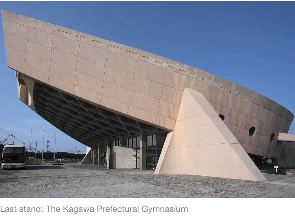 A modern architectural structure with a curved design in Japan, surrounded by trees, is at risk of being repurposed