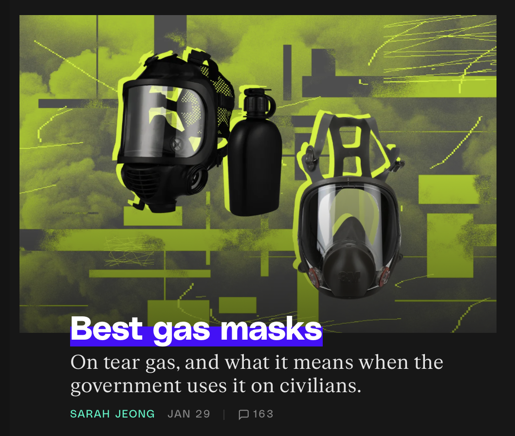 Screenshot from the Verge: Two gas masks and a bottle are displayed against an abstract, green and black background with text about gas masks and their use.