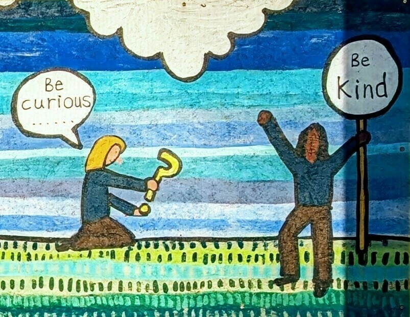 Auto-generated description: A drawing features two figures under a cloud and blue sky, with one holding a question mark and speech bubble saying Be curious, while the other holds a sign stating Be Kind.