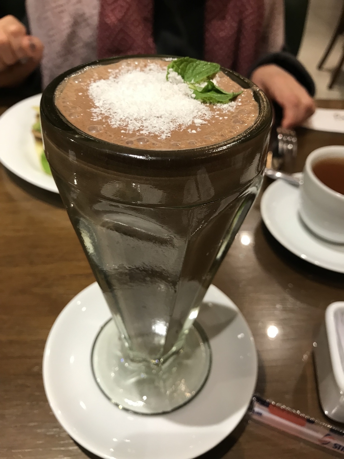 Hot chocolate in a large milk shake glass