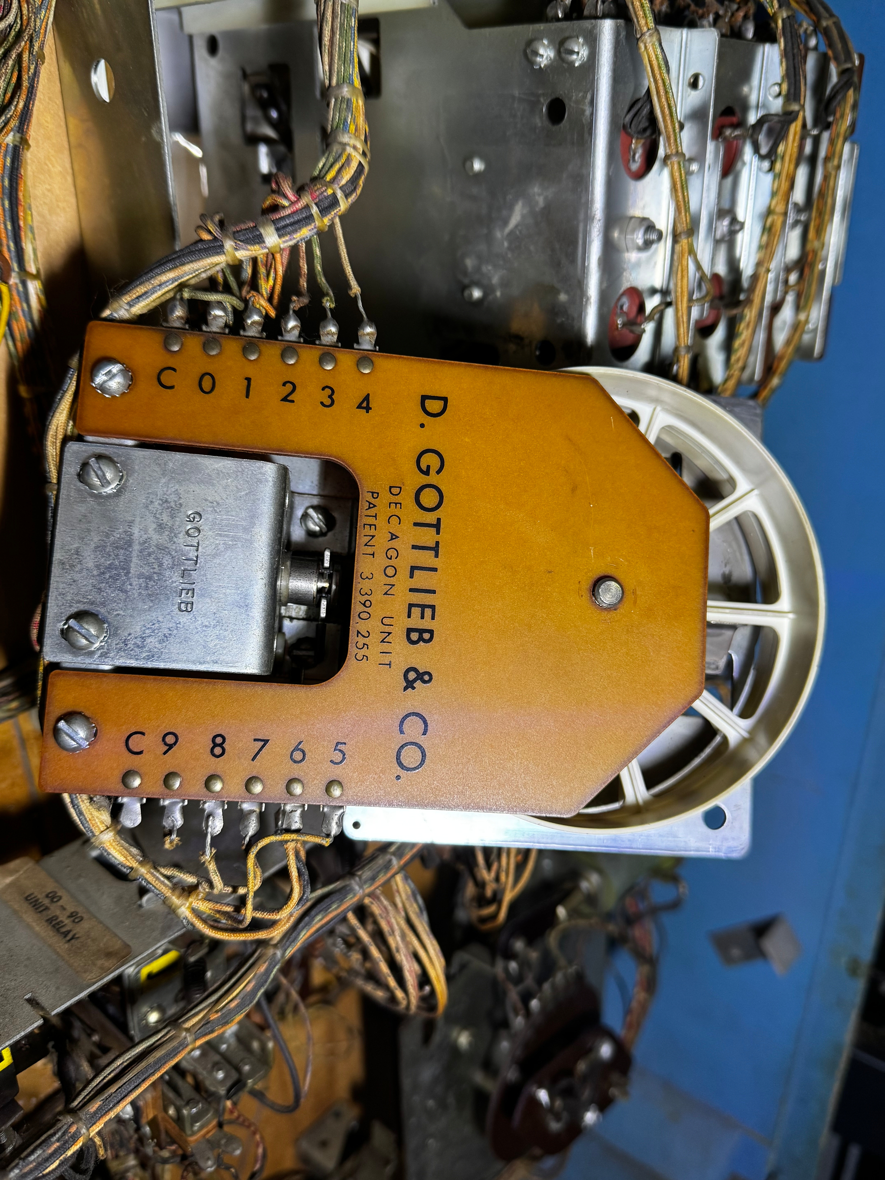 A vintage mechanical component from D. Gottlieb & Co., featuring wiring and labeled connectors.