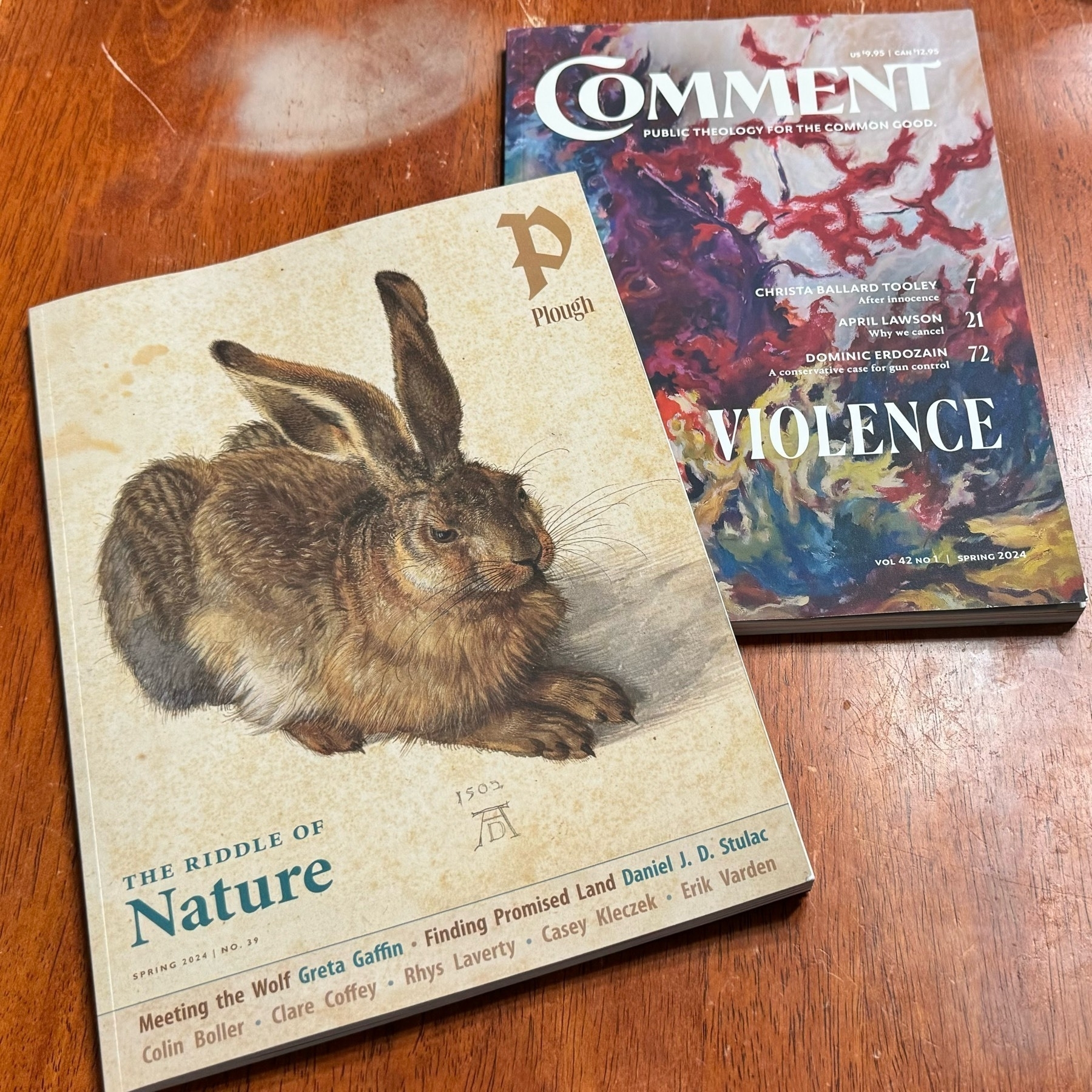The covers of two magazines, Plough Quarterly and Comment. 
