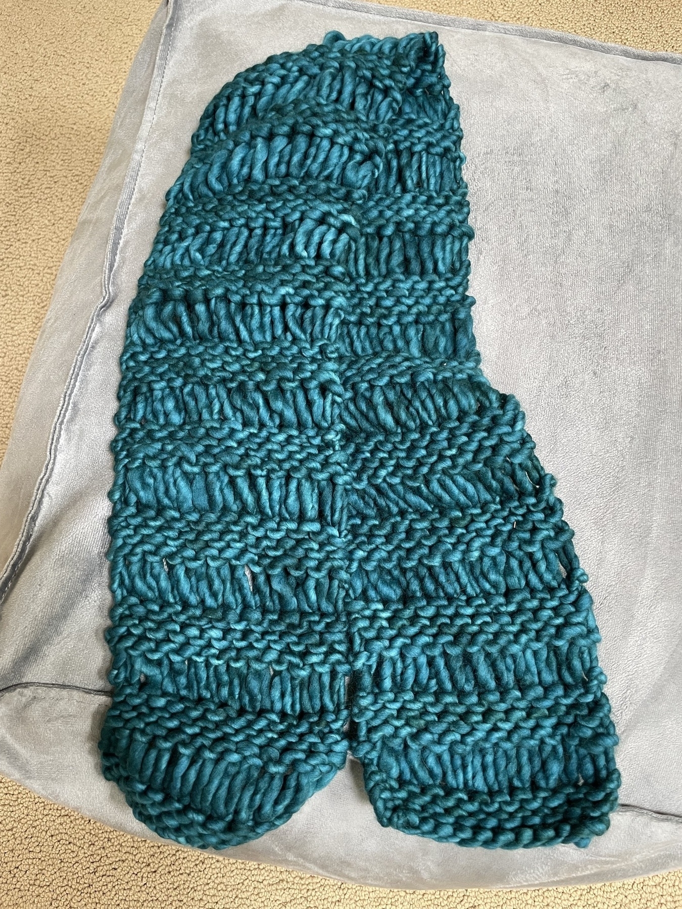 knitted drop-stitch scarf in bulky teal yarn