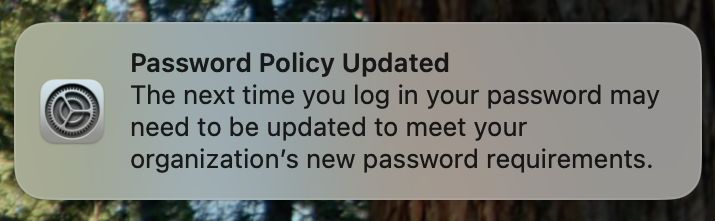 macOS Notification screenshot, title: Password Policy Updated, body: The next time you log in your password may need to be updated to meet your organisation's new password requirements.