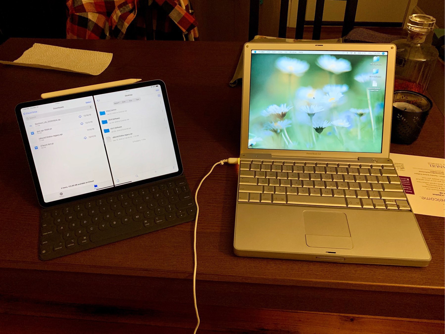 An iPad Pro next to a PowerBook G4 on a table