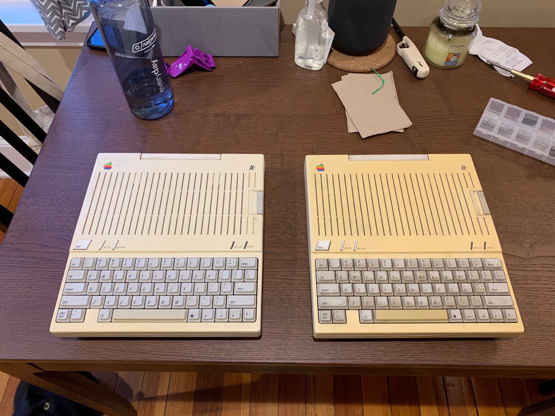 two Apple 2c computers, one in better condition