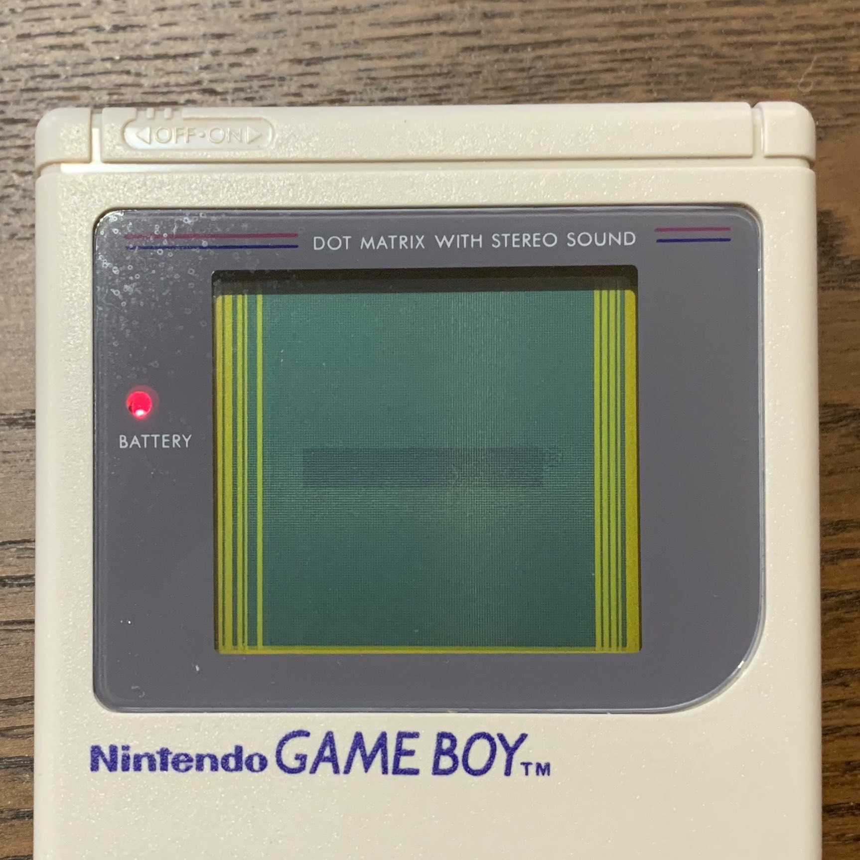 original game boy with dead lines on screen