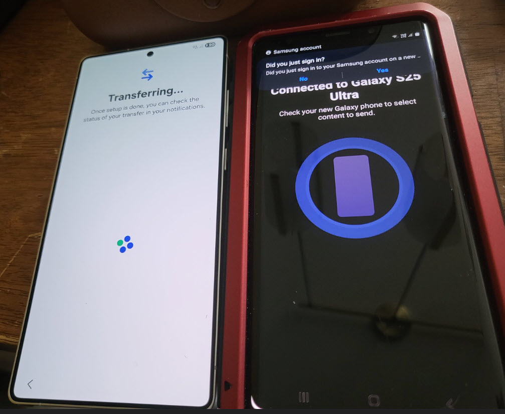 Auto-generated description: Two smartphones are shown, one transferring data to the other using the Samsung Smart Switch application.