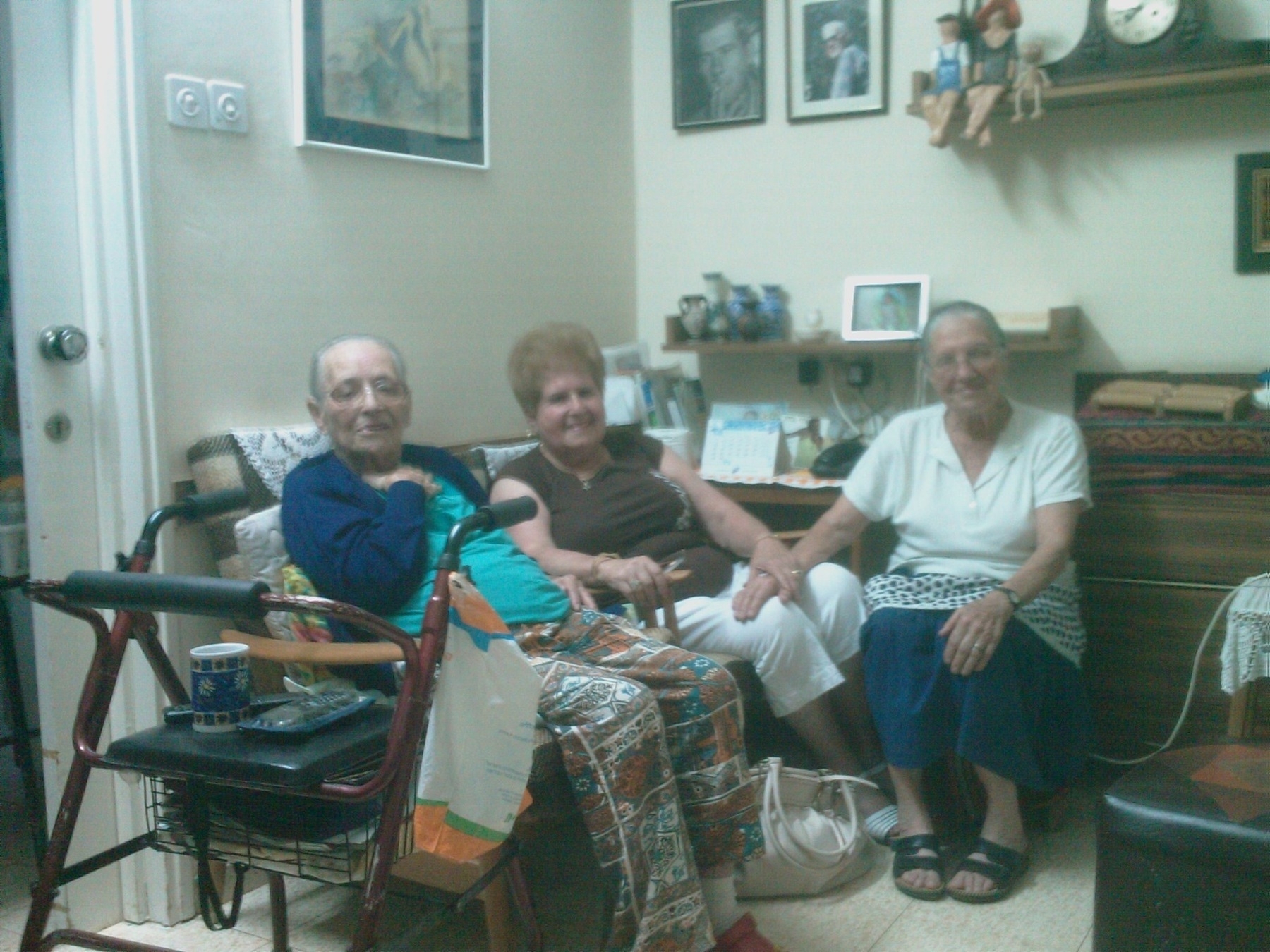 Three elderly women sitting in a living room.