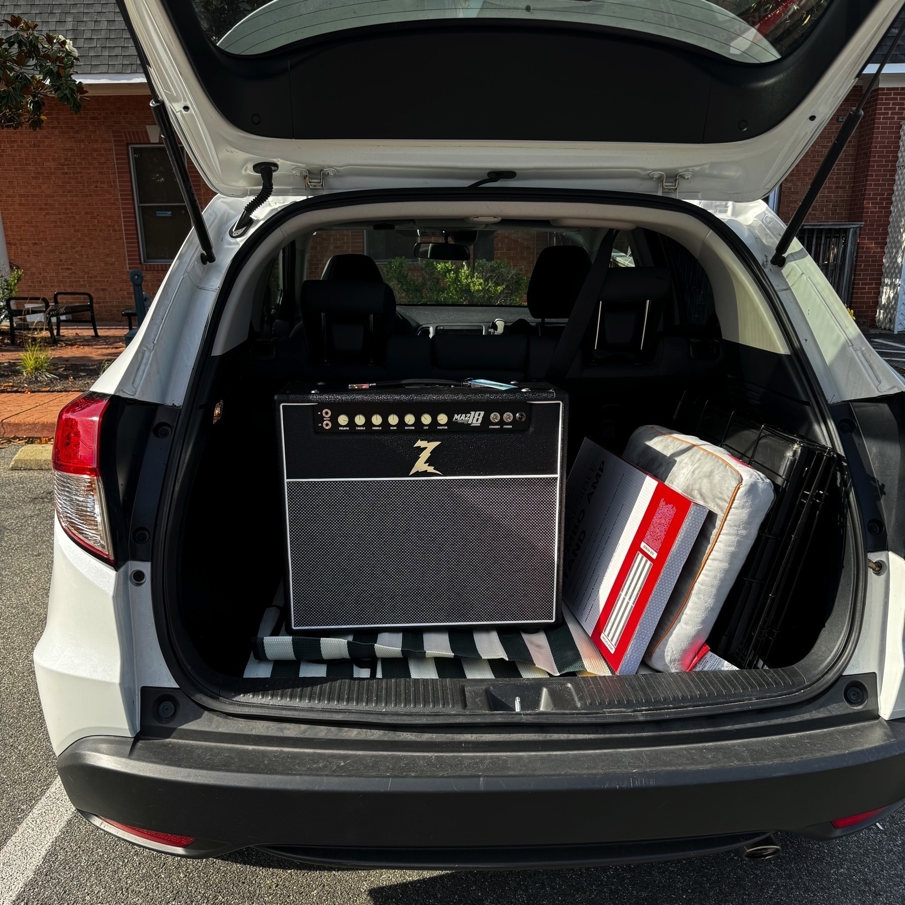 Dr. Z Maz 18 Jr. 1x12 in black in the back of a white Honda HRV with the hatch open.