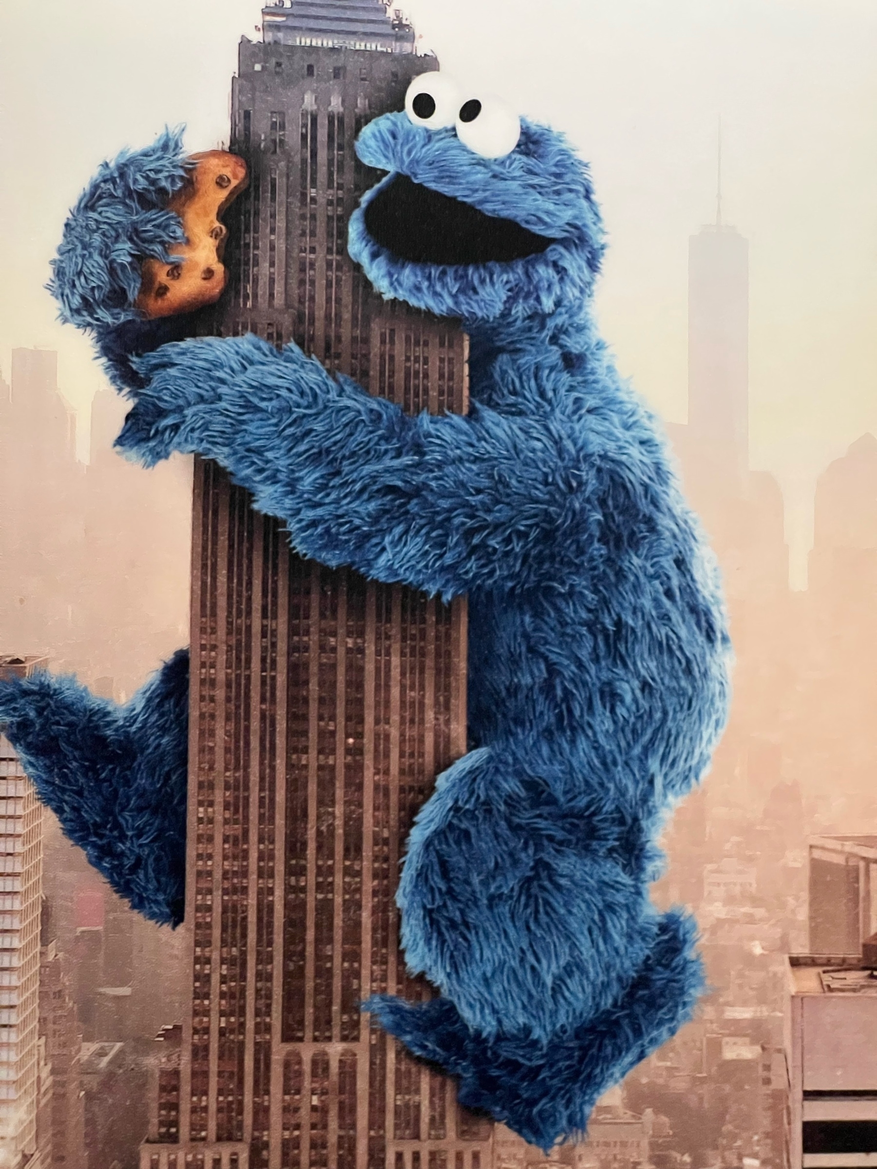 The Cookie Monster on the Eiffel Tower, eating a cookie